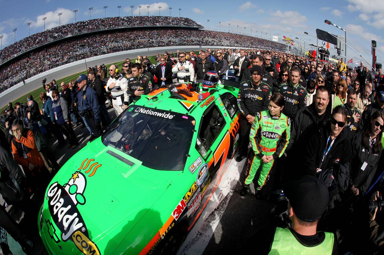 DAYTONA BEACH, FL - FEBRUARY 13:  Danica Patrick, driver of the #7 GoDaddy.com Chevrolet, stands on the grid during practice for the NASCAR Nationwide Series Drive4COPD 300 at Daytona International Speedway on February 13, 2010 in Daytona Beach, Florida.  (Photo by Jonathan Ferrey/Getty Images for NASCAR) *** Local Caption *** Danica Patrick