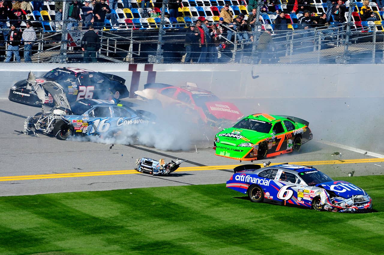 DAYTONA BEACH, FL - FEBRUARY 13:  Danica Patrick, driver of the #7 GoDaddy.com Chevrolet, Colin Braun, driver of the #16 Con-way Freight Ford and Ricky Stenhouse Jr., driver of the #6 CitiFinancial Ford, crash during the NASCAR Nationwide Series Drive4COPD 300 at Daytona International Speedway on February 13, 2010 in Daytona Beach, Florida.  (Photo by Sam Greenwood/Getty Images) *** Local Caption *** Danica Patrick;Colin Braun;Ricky Stenhouse Jr.