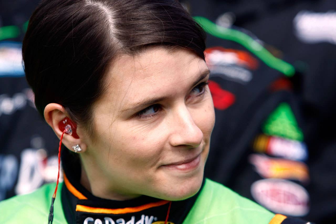 DAYTONA BEACH, FL - FEBRUARY 13:  Danica Patrick, driver of the #7 GoDaddy.com Chevrolet, stands on the grid during practice for the NASCAR Nationwide Series Drive4COPD 300 at Daytona International Speedway on February 13, 2010 in Daytona Beach, Florida.  (Photo by Jonathan Ferrey/Getty Images for NASCAR) *** Local Caption *** Danica Patrick