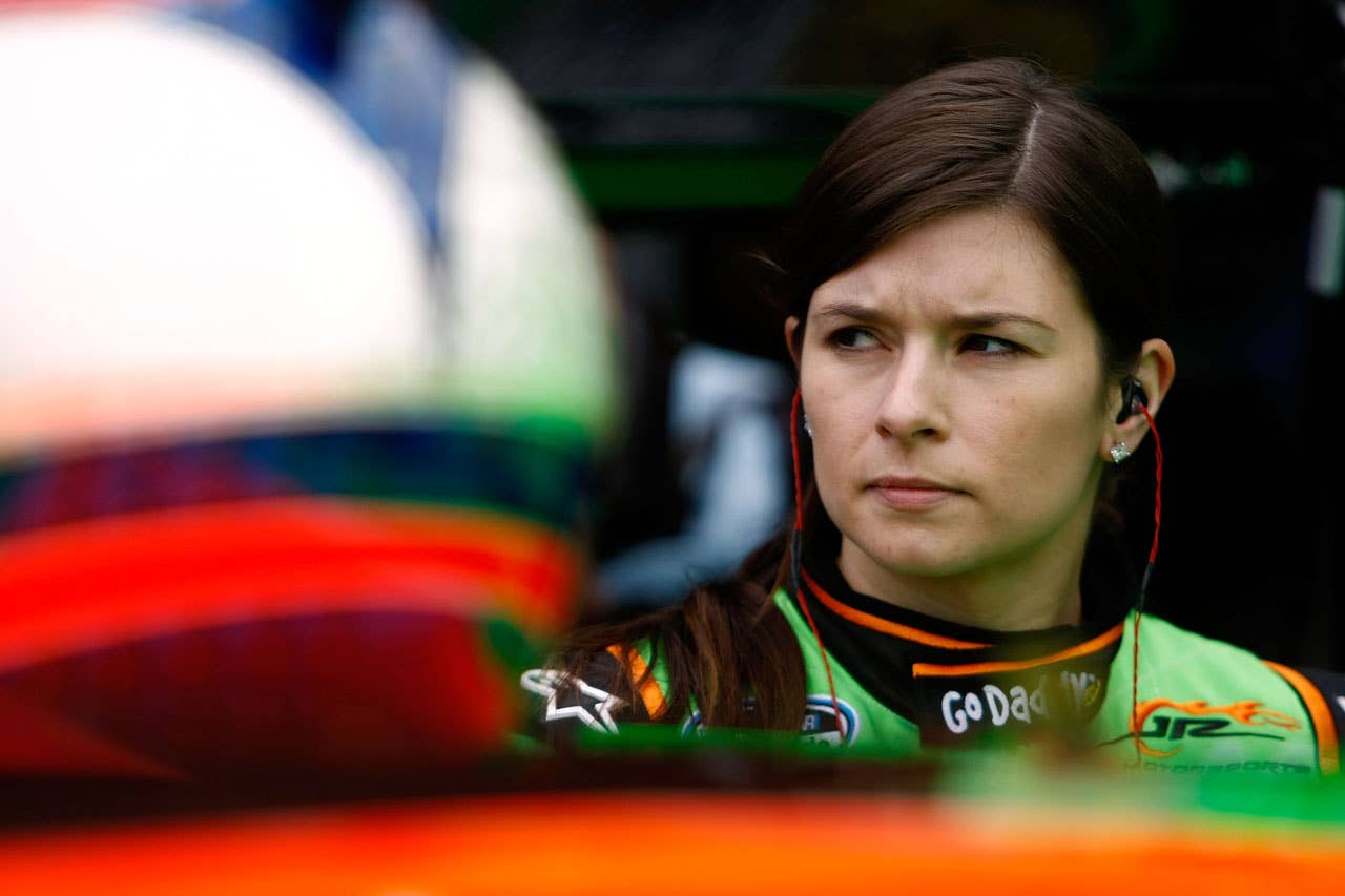 DAYTONA BEACH, FL - FEBRUARY 11:  Danica Patrick, driver of the #7 Go Daddy Chevrolet, stands in the garage area during practice for the NASCAR Nationwide Series DRIVE4COPD 300 at Daytona International Speedway on February 11, 2010 in Daytona Beach, Florida.  (Photo by Jonathan Ferrey/Getty Images for NASCAR) *** Local Caption *** Danica Patrick