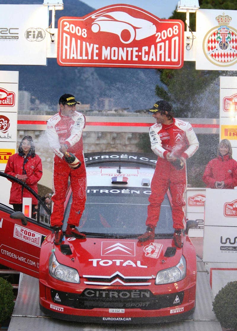 French driver Sebastien Loeb (R) and his co-driver, Daniel Elena from Monaco celebrate after winning the 76th Monte-Carlo rally, 27 January 2008 in Monaco. Loeb won the event ahead of Finnish Mikko Hirvonen and Australian Chris Atkinson.