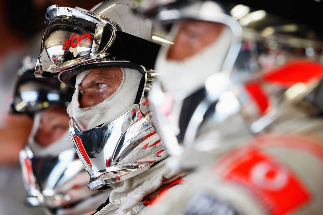 F1 Grand Prix of Europe - Race VALENCIA, SPAIN - AUGUST 23: McLaren Mercedes mechanics watch the race unfold in their team garage during the European Formula One Grand Prix at the Valencia Street Circuit on August 23, 2009, in Valencia, Spain. (Photo by Mark Thompson/Getty Images)