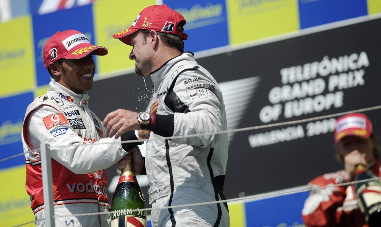 Brawn GP's Brazilian driver Rubens Barri Brawn GP's Brazilian driver Rubens Barrichello (C) is congratulated by McLaren Mercedes' British driver Lewis Hamilton on the podium of the Valencia Street Circuit on August 23, 2009 in Valencia, after the Formula One Grand Prix of Europe. Brawn GP's Brazilian driver Rubens Barrichello won the race ahead of McLaren Mercedes' British driver Lewis Hamilton and Ferrari's Finnish driver Kimi Raikkonen. AFP PHOTO / FRED DUFOUR (Photo credit should read FRED DUFOUR/AFP/Getty Images)