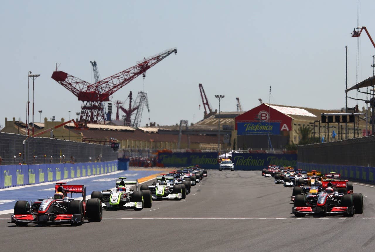 F1 Grand Prix of Europe - Race VALENCIA, SPAIN - AUGUST 23: Lewis Hamilton (L) of Great Britain and McLaren Mercedes leads the field at the start of the European Formula One Grand Prix at the Valencia Street Circuit on August 23, 2009, in Valencia, Spain. (Photo by Ryan Pierse/Getty Images)