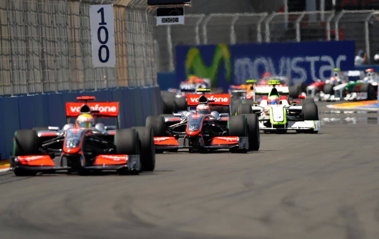 McLaren Mercedes' British driver Lewis H McLaren Mercedes' British driver Lewis Hamilton drives ahead of McLaren Mercedes' Finnish driver Heikki Kovalainen and Brawn GP's Brazilian driver Rubens Barrichello at the Valencia Street Circuit on August 23, 2009 in Valencia, during the Formula One Grand Prix of Europe. AFP PHOTO / RAFA RIVAS (Photo credit should read RAFA RIVAS/AFP/Getty Images)