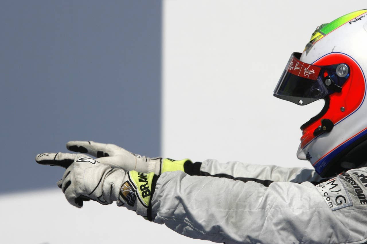 Brawn GP's Brazilian driver Rubens Barri Brawn GP's Brazilian driver Rubens Barrichello celebrates in the parc ferme of the Valencia Street Circuit on August 23, 2009 in Valencia, after the Formula One Grand Prix of Europe. Brawn GP's Brazilian driver Rubens Barrichello won the race ahead of McLaren Mercedes' British driver Lewis Hamilton and Ferrari's Finnish driver Kimi Raikkonen. AFP PHOTO / JOSE JORDAN (Photo credit should read JOSE JORDAN/AFP/Getty Images)