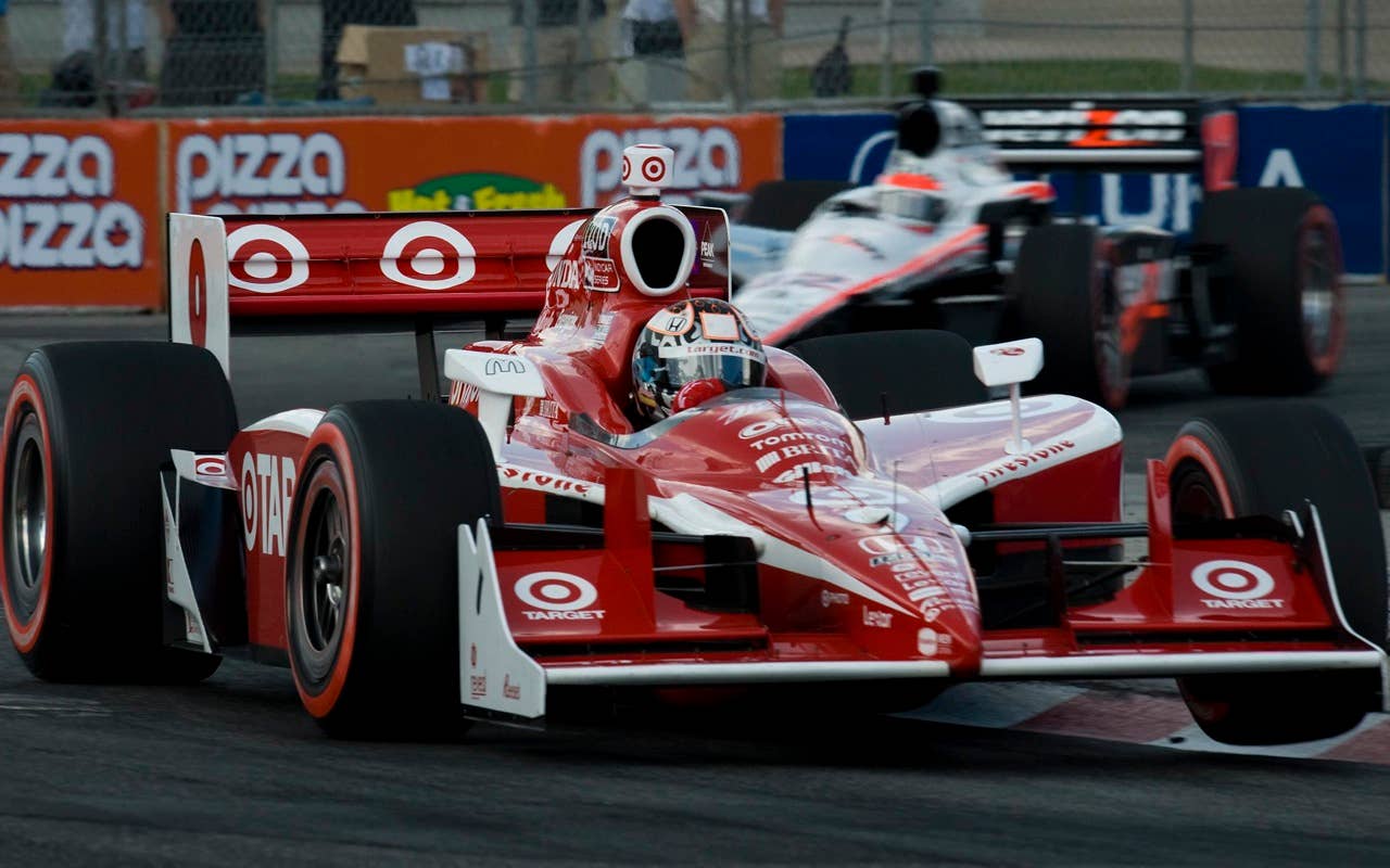 Scott Dixon of New Zealand, followed by Will Power of Australlia, drive during qualification for the Toronto INDY in Toronto on Saturday, July 17, 2010.