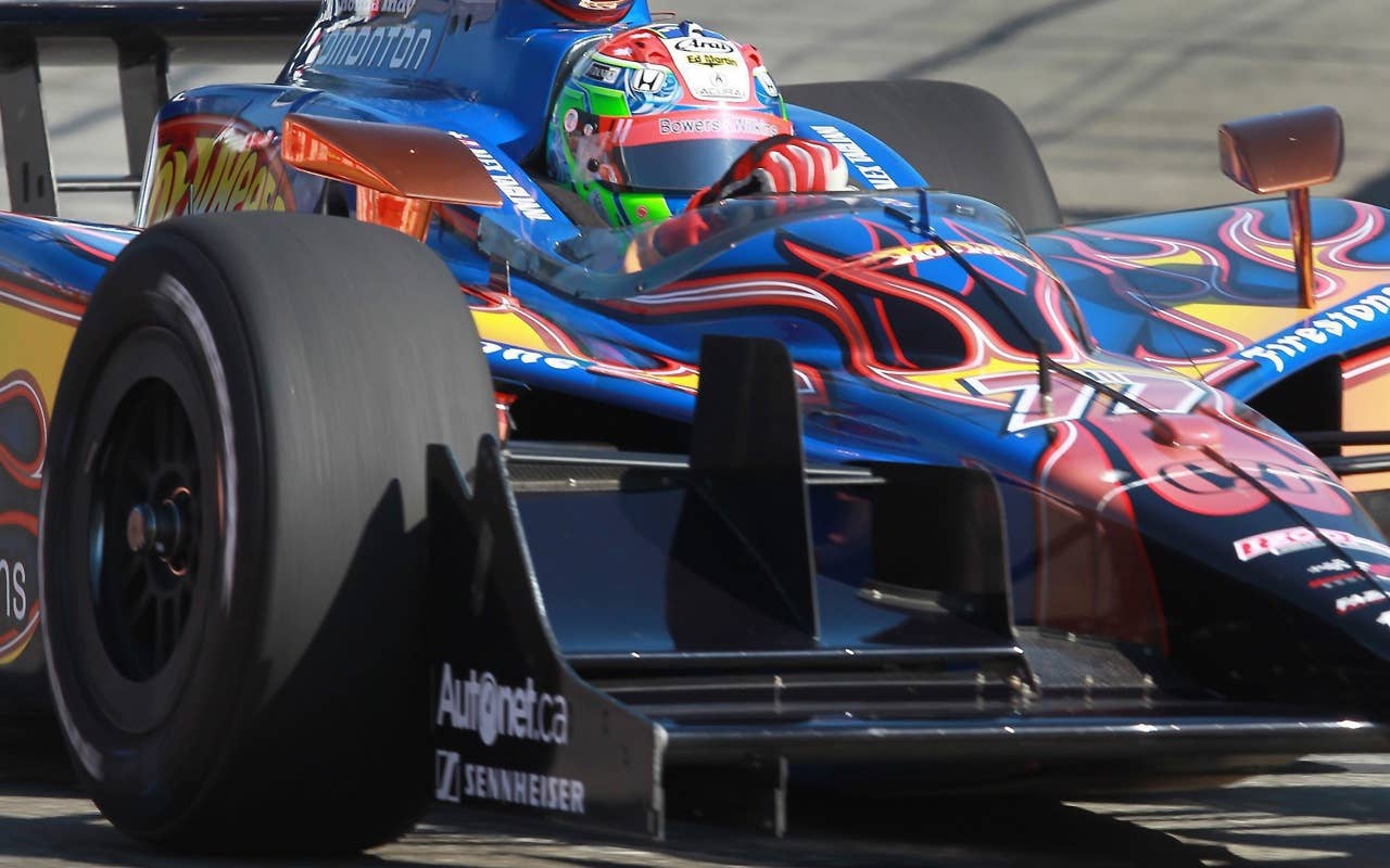 Alex Tagliani drives on the track during a practice session for the Toronto INDY auto race in Toronto on Saturday, July 17, 2010.
