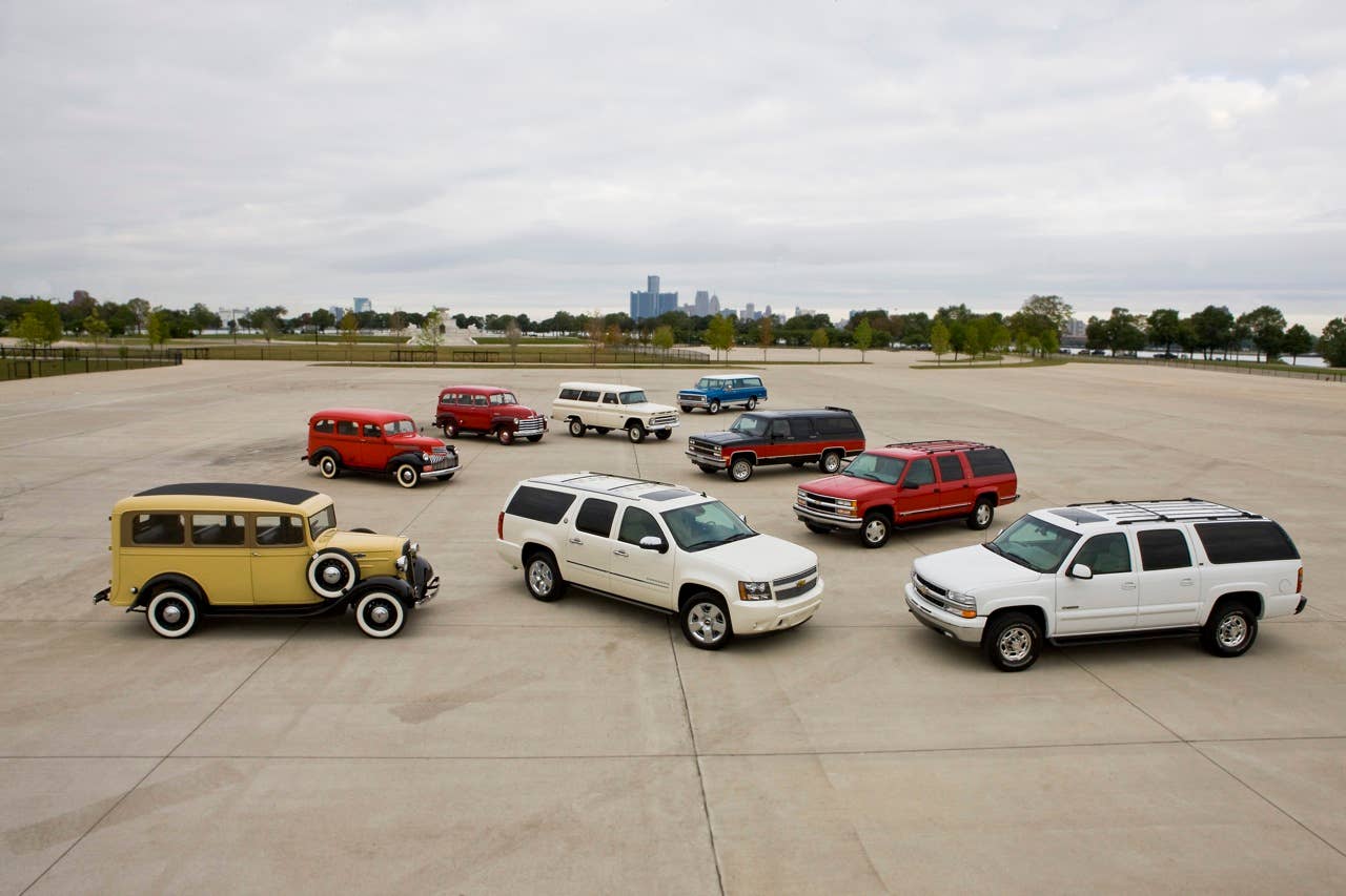 75 years of Chevrolet Suburban (clockwise from left), 1936, 1946, 1951, 1966, 1972, 1990, 1999, 2002 and 2010 75th Anniversary Diamond Edition (center).