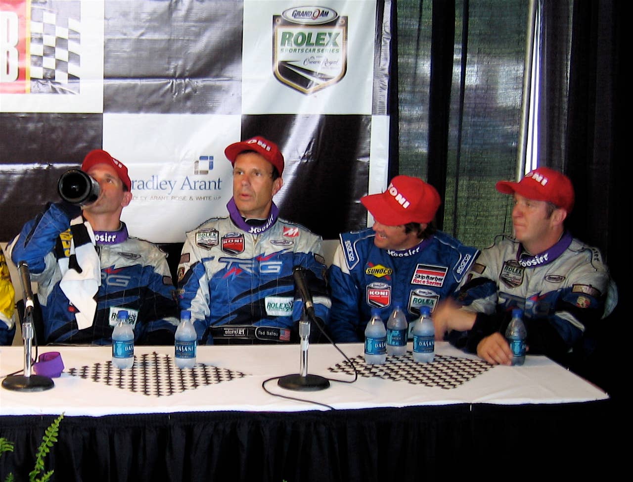Andy Lally (left, with the champagne) and Ted Ballou (second from left) took the checkered, Sunday morning, in the KONI Challenge Series at Barber Motorsports in Birmingham, Ala.