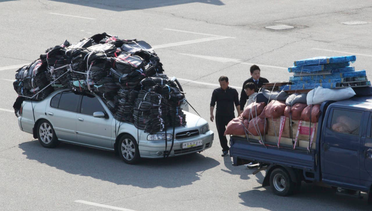 South Korean vehicles carrying products from North Korea's Kaesong industrial complex arrive at the customs, immigration and quarantine office near the border village of Panmunjom in Paju, South Korea, Saturday, April 27, 2013. South Korea said Friday that it has decided to withdraw the roughly 175 South Koreans still at a jointly run factory complex in North Korea, raising a major question about the survival of the last symbol of inter-Korean cooperation. (AP Photo/Ahn Young-joon)