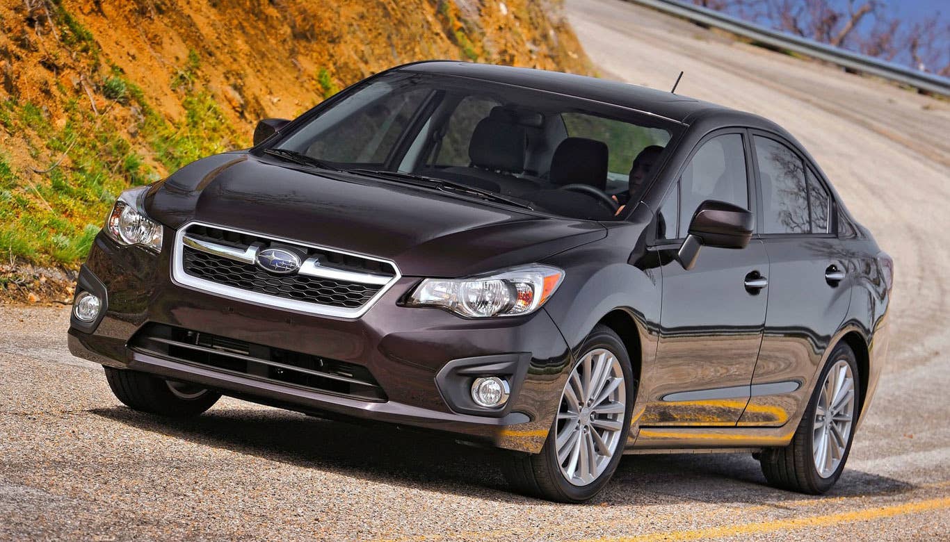 Sticker Price: $17,895 - $23,195 Invoice Price: $17,104 - $21,978 Fuel Economy: 25 mpg City, 34 mpg Highway  TheSubaru Impreza achieving 34 mpg on the highway isn't much to write home about, but the fact that it hits that pretty solid number with standard all-wheel drive is impressive. This small sedan offers all-weather versatility, while still being easy on your wallet when it comes to the pump.  The Impreza is also one of the safest and most reliable cars in its class. Many people who switch to the Subaru brand tend not to switch back. Cars like the Impreza make it fairly easy to see why.  Research the Subaru Impreza Subaru Impreza Overview Subaru Impreza Photos & Video Subaru Impreza Local Dealer Price Quote