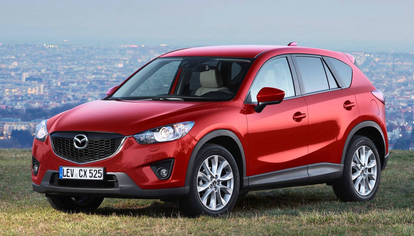 Sticker Price: $21,545 - $29,220 Invoice Price: $20,929 - $28,377 Fuel Economy: 26 mpg City, 35 mpg Highway  Thought this list was going to be filled with cars the size of postage stamps, didn’t you? There are a few exceptions to the size-determines-fuel-economy convention.  The excellent CX-5 is one of them. Mazda achieves 26 mpg in the city and 35 mpg on the highway, the best fuel economy in the small SUV segment, through the use of its SkyActiv engine technology.  What is SkyActiv? In short, it’s Mazda’s way of saying it found a way to increase mileage and engine output by increasing the compression ratio. It may not be your grandaddy's internal combustion engine, but rest assured, it is an internal combustion engine.  Research the Mazda CX-5 Mazda CX-5 Overview Mazda CX-5 Photos & Video Mazda CX-5 Local Dealer Price Quote