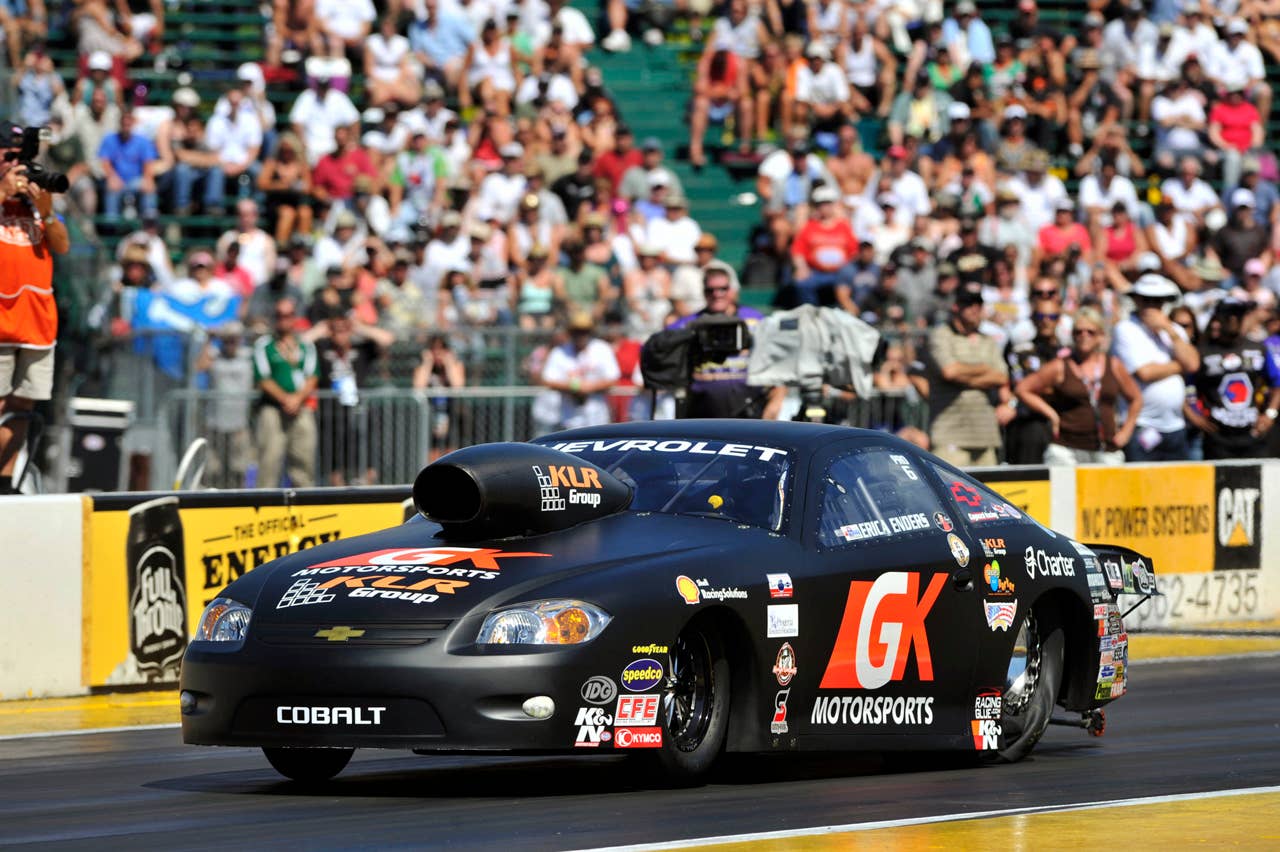 In this photo provided by NHRA, Erica Enders celebrates her win at the O'Reilly Auto Parts NHRA Northwest Nationals auto race at Pacific Raceways, Sunday, Aug. 5, 2012, in Kent, Wash. (AP Photo/NHRA, Theresa Long)