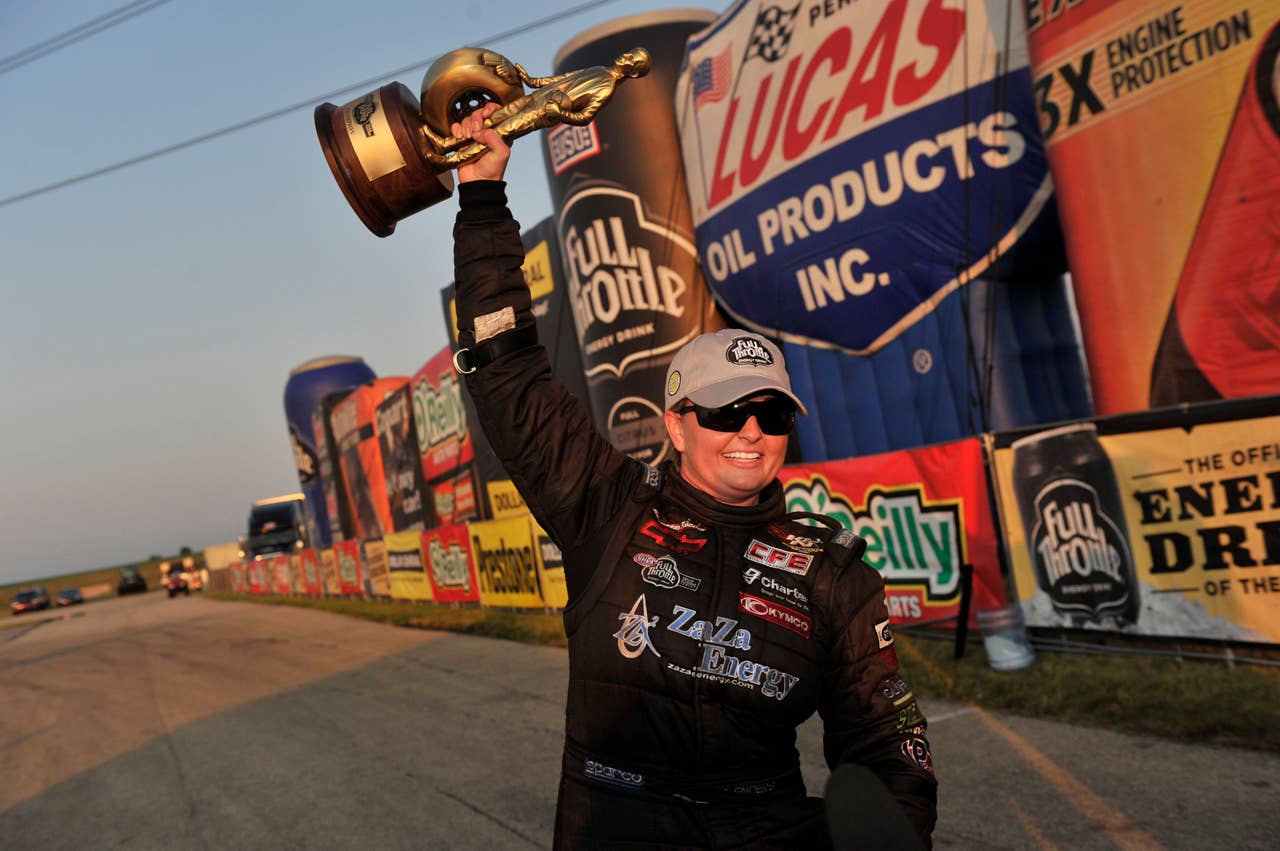 In this photo provided by NHRA, Pro Stock winner Erica Enders, from Houston, celebrates after racing to victory Sunday July 1, 2012,  at the Route 66 NHRA Nationals at Route 66 Raceway in Joliet, Ill. Enders is the first woman to win an NHRA Pro Stock event by defeating Greg Anderson in the final round of the NHRA Full Throttle Drag Racing Series event.  (AP Photo/NHRA, Theresa Long)