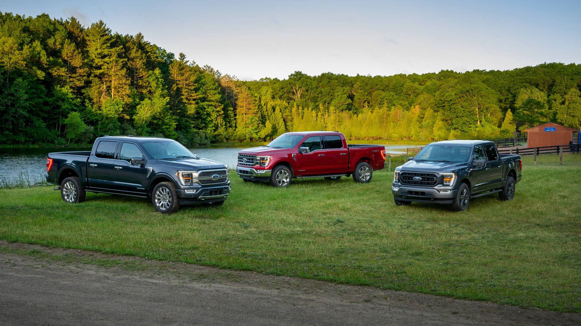 (left to right) All-new F-150 Limited in Smoked Quartz Tinted Clearcoat, F-150 Lariat in Rapid Red Metallic Tinted Clearcoat and F-150 XLT Sport Appearance Package in Carbonized Gray.