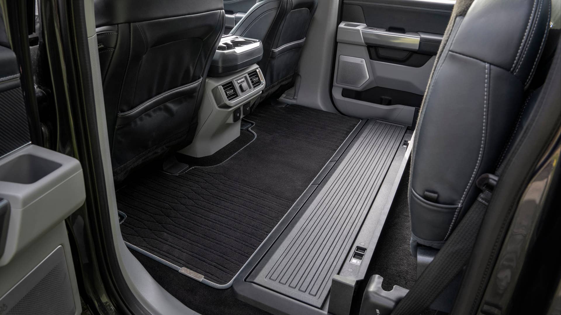 Easily accessed flat load floor in the back of F-150 crew cabs allows customers to carry large items inside the cab.
