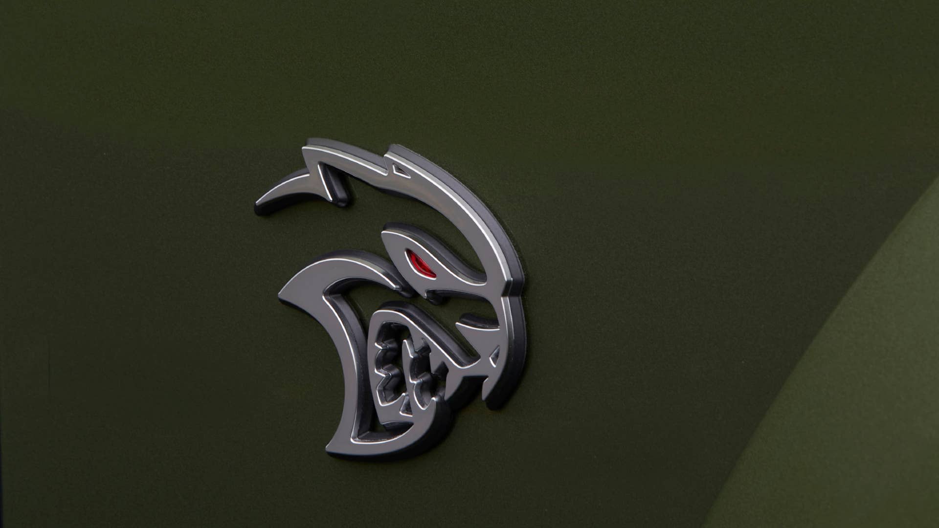 Satin Chrome Hellcat fender badging on the 2022 Dodge Challenger SRT Hellcat Redeye Widebody Jailbreak. Challenger Jailbreak models offer the choice of five exterior badging finishes.