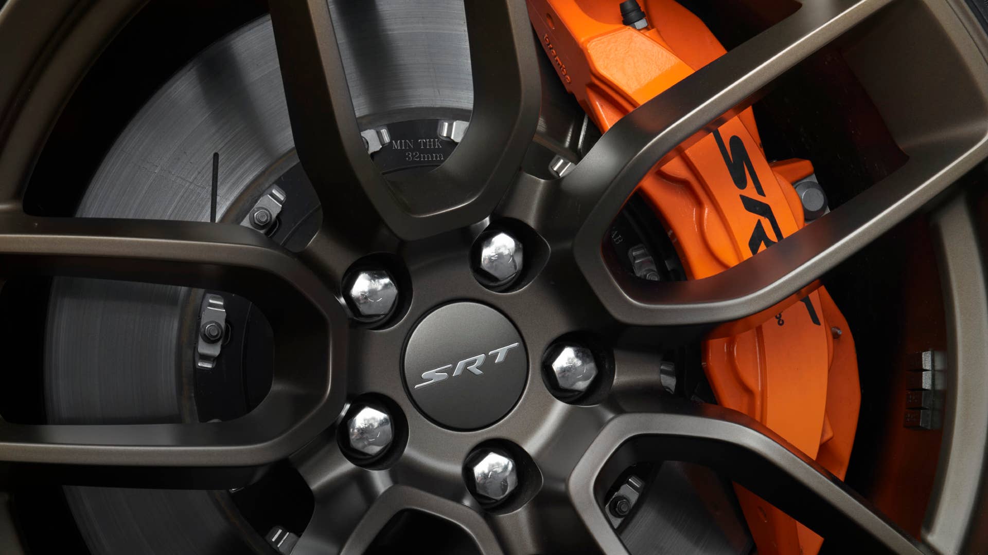 2022 Dodge Charger SRT Hellcat Redeye Widebody Jailbreak model with 20-by-11-inch Brass Monkey wheels paired with orange brake calipers. Charger Jailbreak models offer seven wheel options and six brake caliper color choices, including blue and yellow.