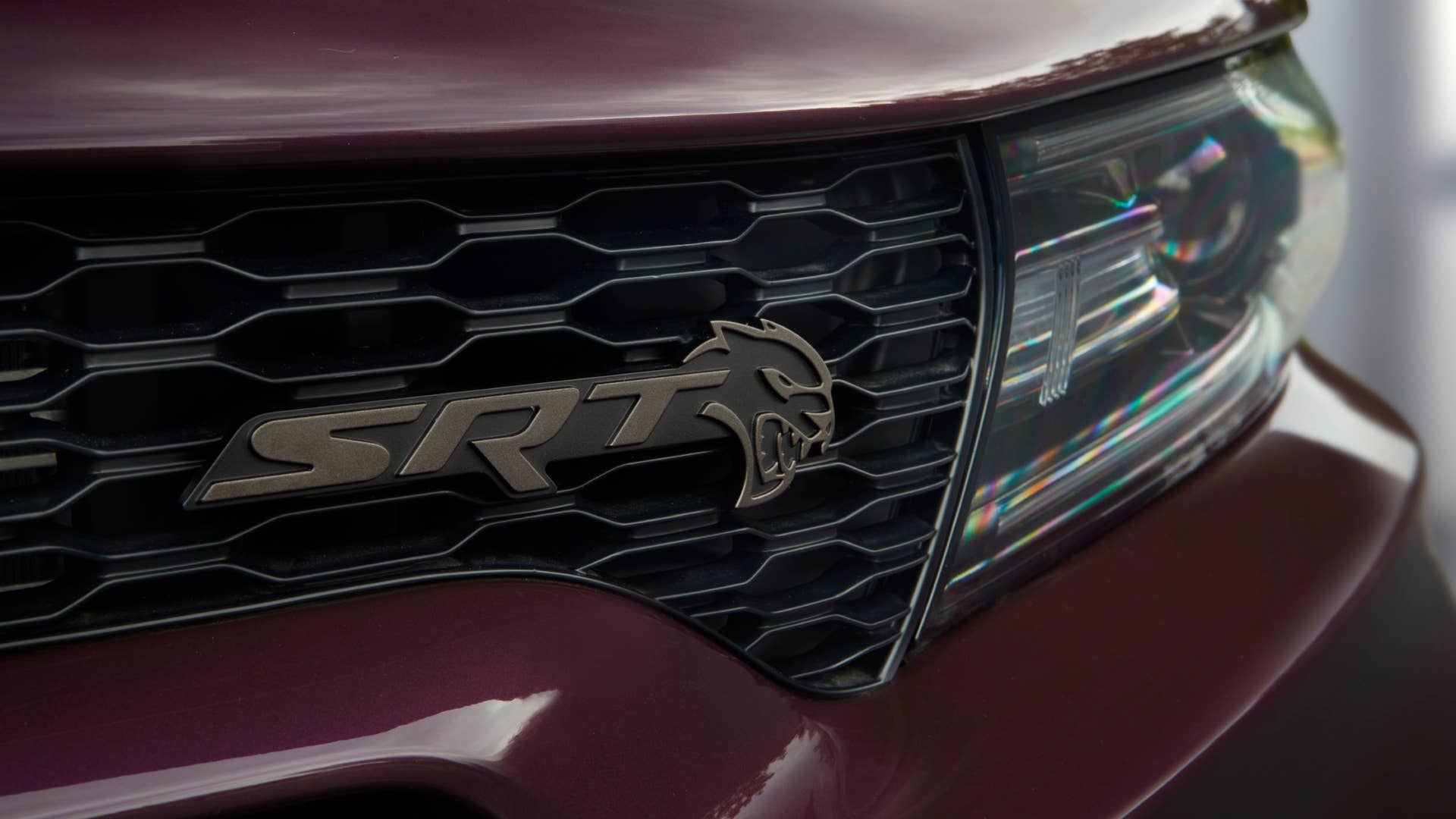 Brass Monkey Hellcat grille badging on the 2022 Dodge Charger SRT Hellcat Redeye Widebody Jailbreak. Charger Jailbreak models offer the choice of five exterior badging finishes.