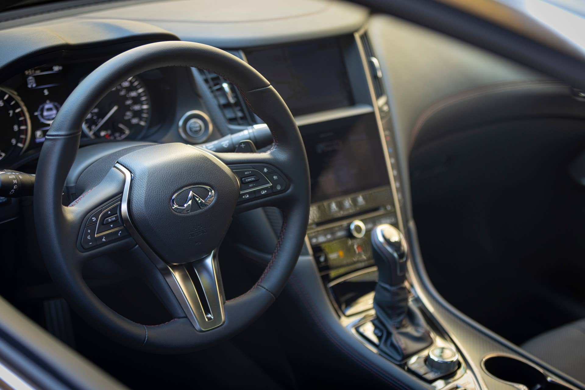 Q60 RED SPORT 400 AWD shown with Graphite trim and contrast red stitching