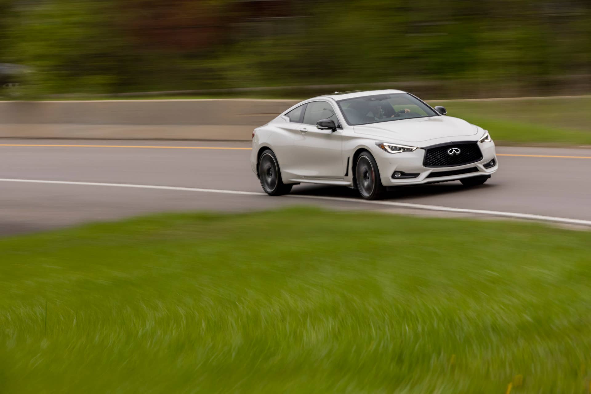 Q60 RED SPORT 400 AWD shown in Majestic White featuring 20-inch accessory alloy wheels
