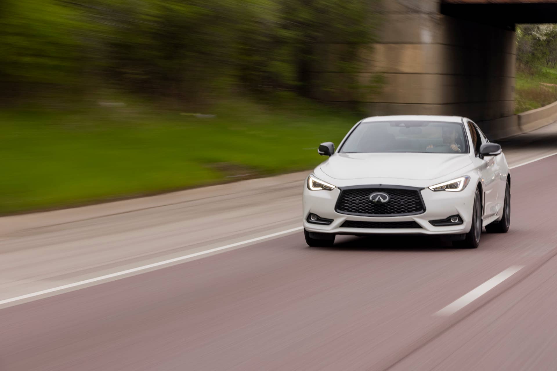 Q60 RED SPORT 400 AWD shown in Majestic White featuring 20-inch accessory alloy wheels