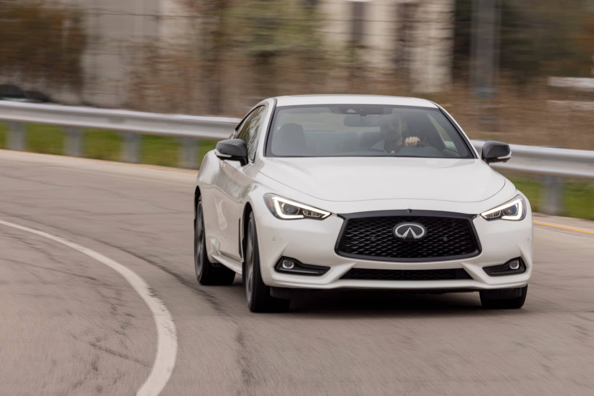 Q60 RED SPORT 400 AWD shown in Majestic White featuring 20-inch accessory alloy wheels