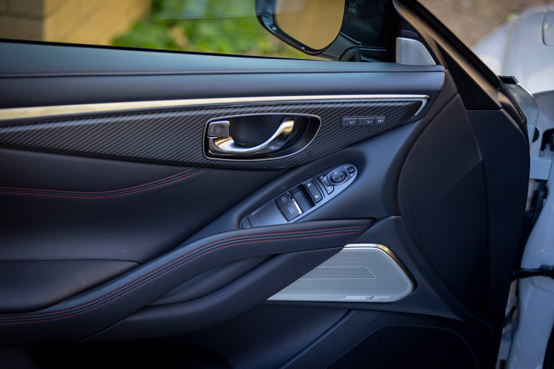 Q60 RED SPORT 400 AWD shown with Graphite trim and contrast red stitching