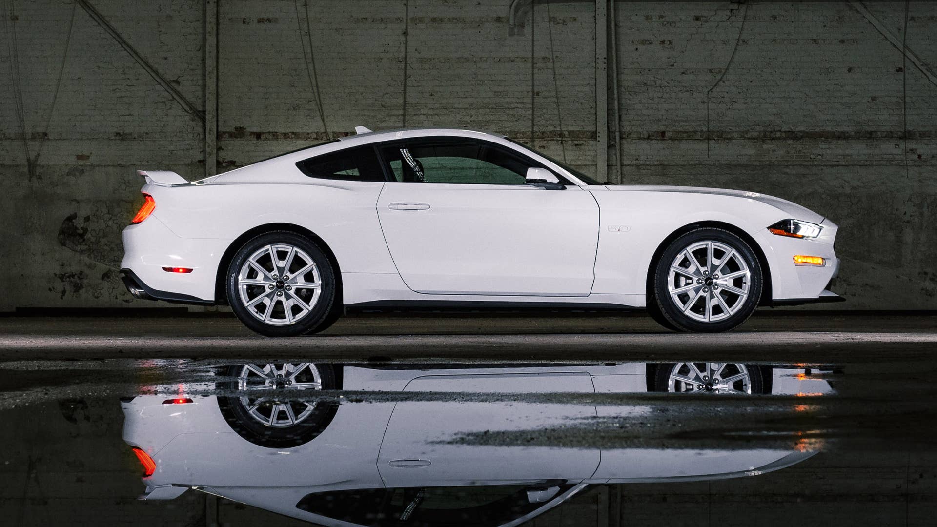 Available Ice White Appearance Package on appropriately configured 2022 Mustang Mach-E and Mustang Coupe models. Closed course.