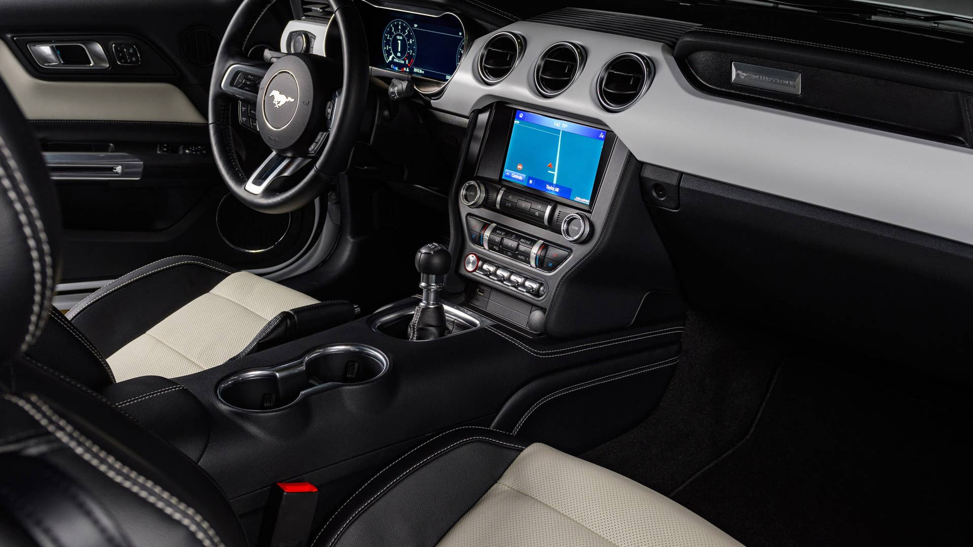 Available Ice White Appearance Package on appropriately configured 2022 Mustang Mach-E and Mustang Coupe models. Closed course.