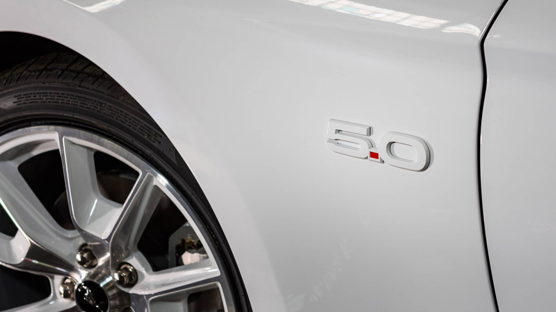 Available Ice White Appearance Package on appropriately configured 2022 Mustang Mach-E and Mustang Coupe models. Closed course.