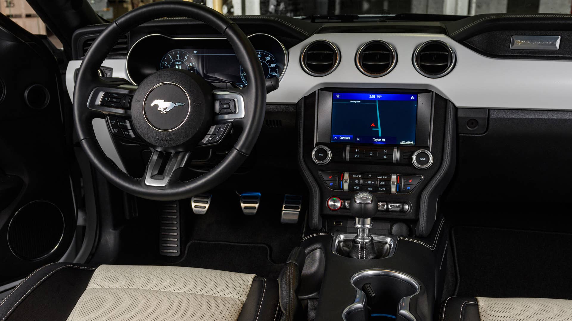 Available Ice White Appearance Package on appropriately configured 2022 Mustang Mach-E and Mustang Coupe models. Closed course.