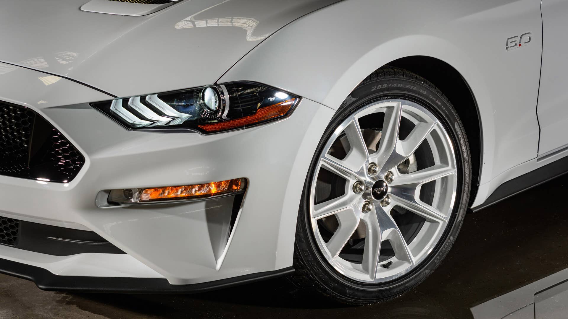 Available Ice White Appearance Package on appropriately configured 2022 Mustang Mach-E and Mustang Coupe models. Closed course.