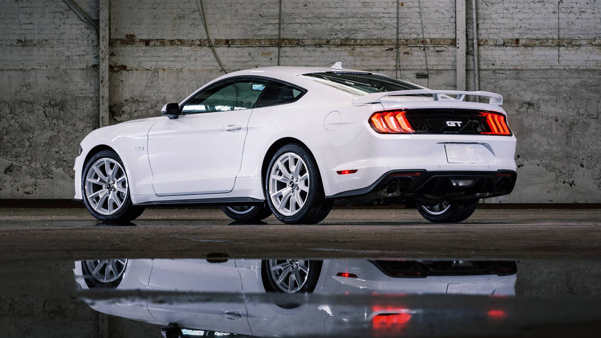 Available Ice White Appearance Package on appropriately configured 2022 Mustang Mach-E and Mustang Coupe models. Closed course.