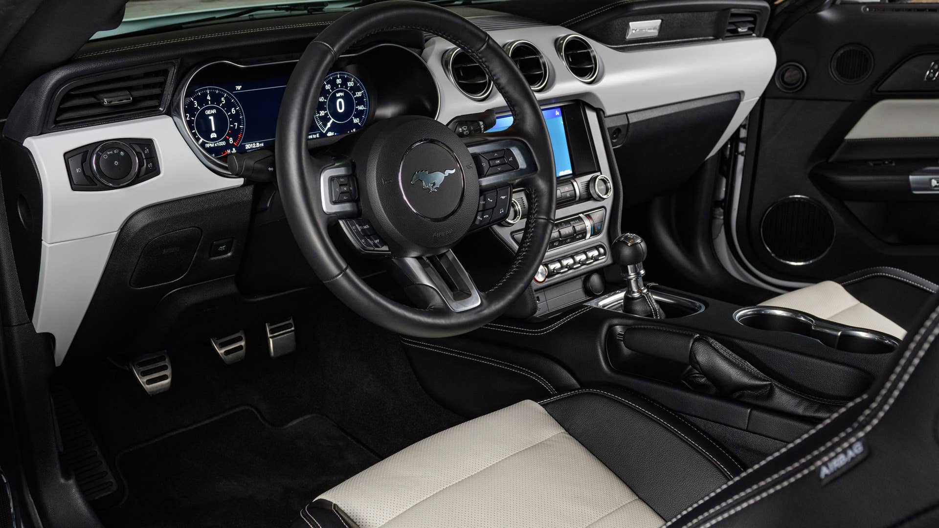 Available Ice White Appearance Package on appropriately configured 2022 Mustang Mach-E and Mustang Coupe models. Closed course.