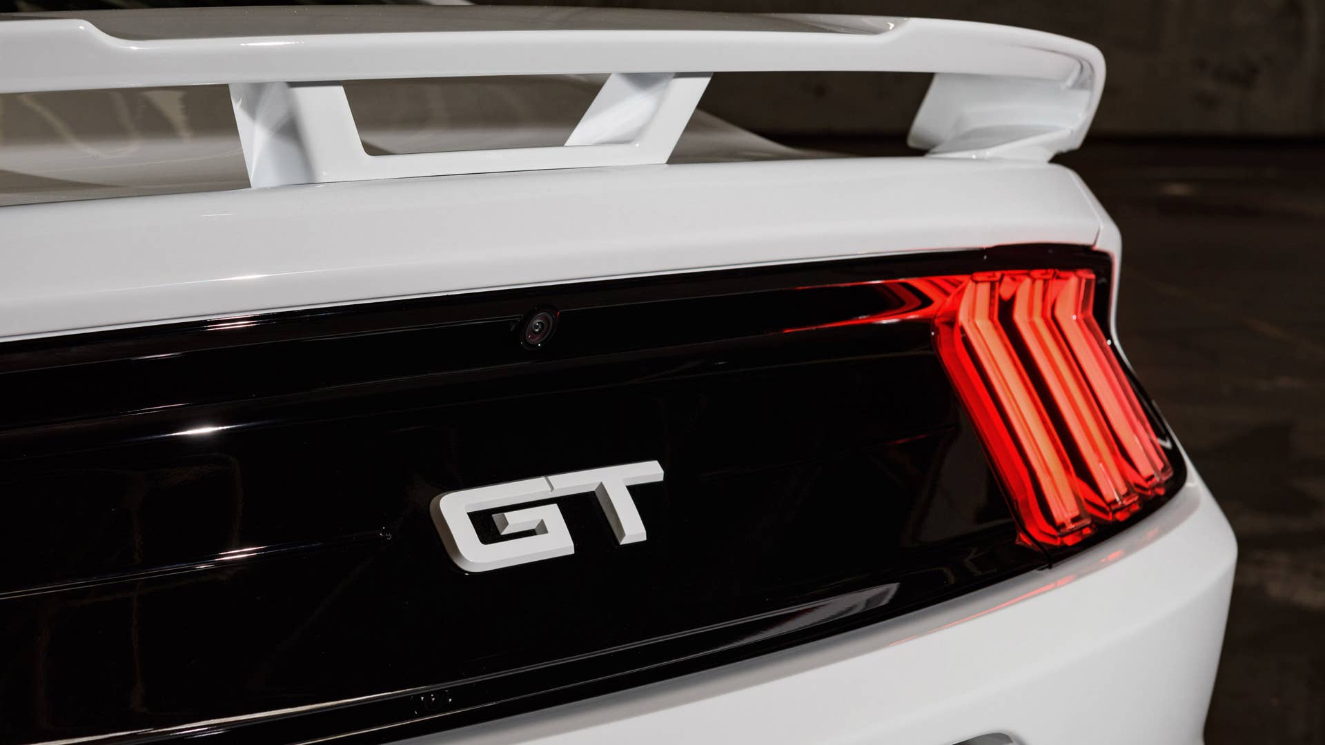 Available Ice White Appearance Package on appropriately configured 2022 Mustang Mach-E and Mustang Coupe models. Closed course.
