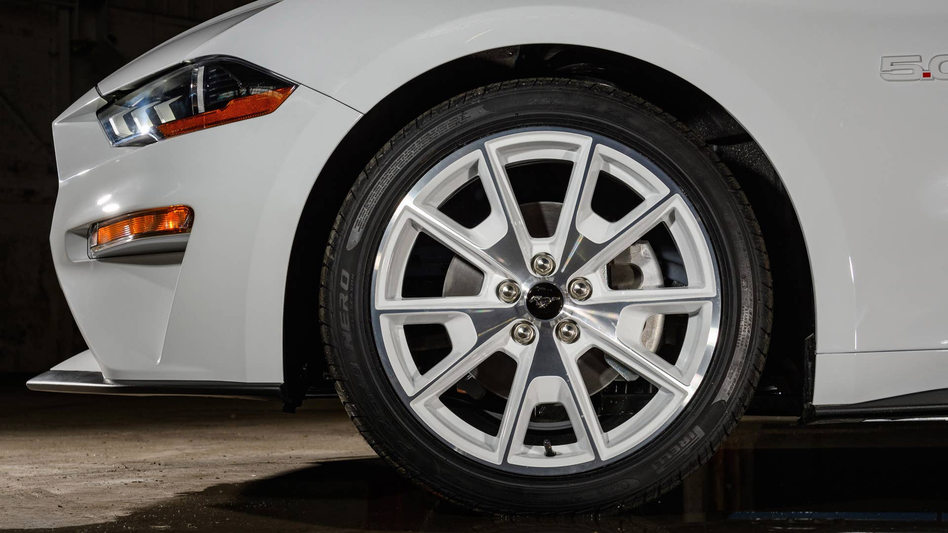 Available Ice White Appearance Package on appropriately configured 2022 Mustang Mach-E and Mustang Coupe models. Closed course.