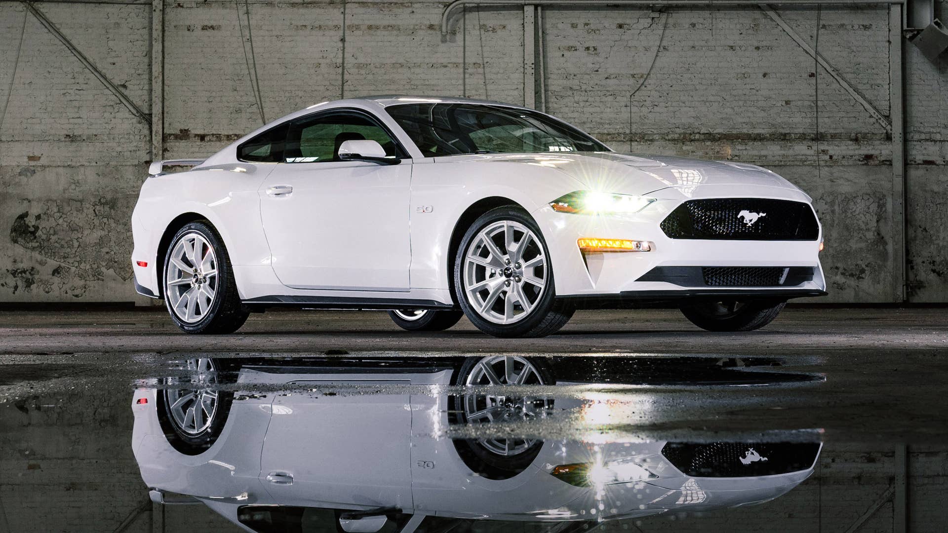 Available Ice White Appearance Package on appropriately configured 2022 Mustang Mach-E and Mustang Coupe models. Closed course.