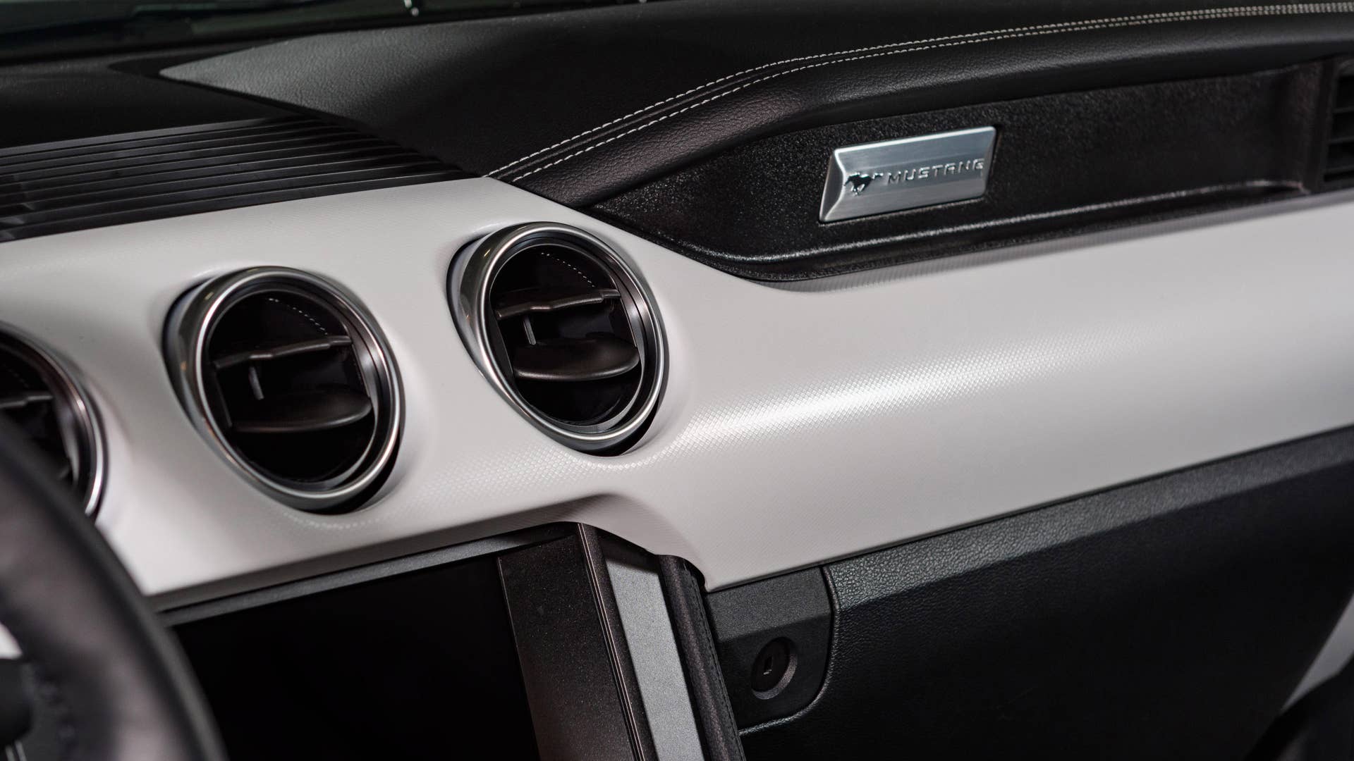Available Ice White Appearance Package on appropriately configured 2022 Mustang Mach-E and Mustang Coupe models. Closed course.