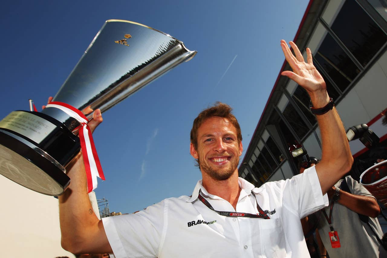 MONTE CARLO, MONACO - MAY 24: Jenson Button of Great Britain and Brawn GP celebrates with the winners trophy in the paddock following victory in the Monaco Formula One Grand Prix at the Monte Carlo Circuit on May 24, 2009 in Monte Carlo, Monaco. (Photo by Mark Thompson/Getty Images)