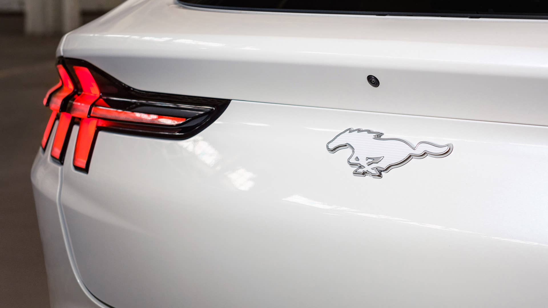 Available Ice White Appearance Package on appropriately configured 2022 Mustang Mach-E and Mustang Coupe models. Closed course.