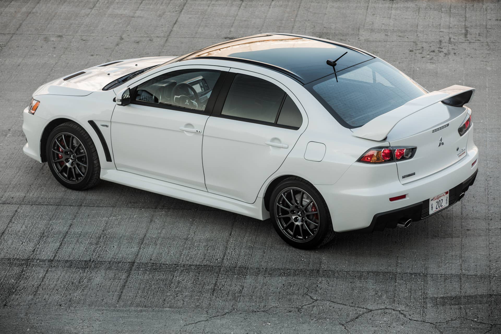 The 2015 Mitsubishi Lancer Evolution Final Edition, overhead rear three-quarter.