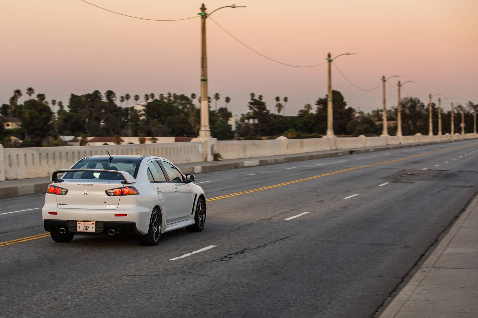 The 2015 Mitsubishi Lancer Evolution Final Edition, dynamic rear three-quarter view.
