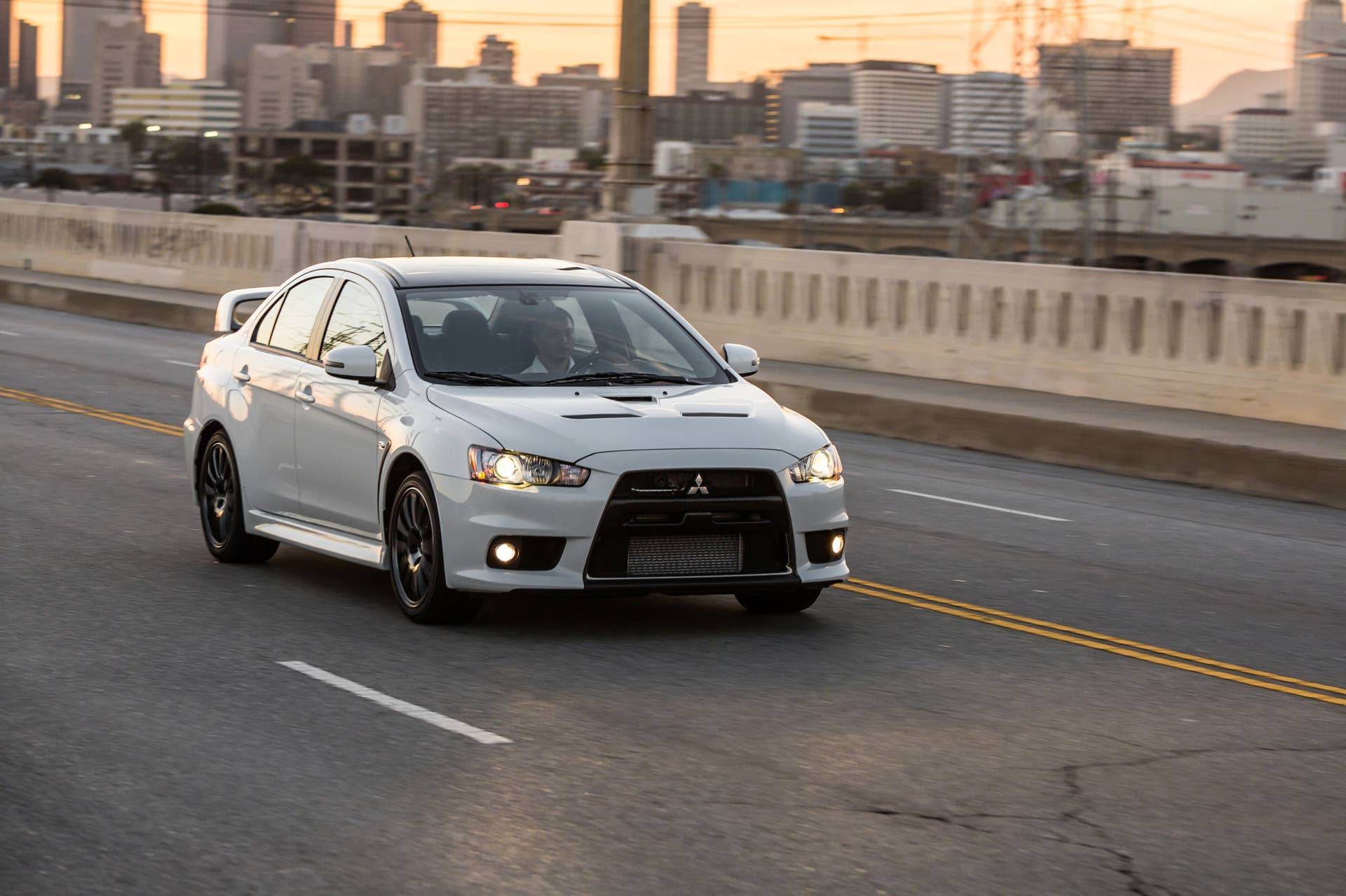 The 2015 Mitsubishi Lancer Evolution Final Edition, dynamic front three-quarter view.