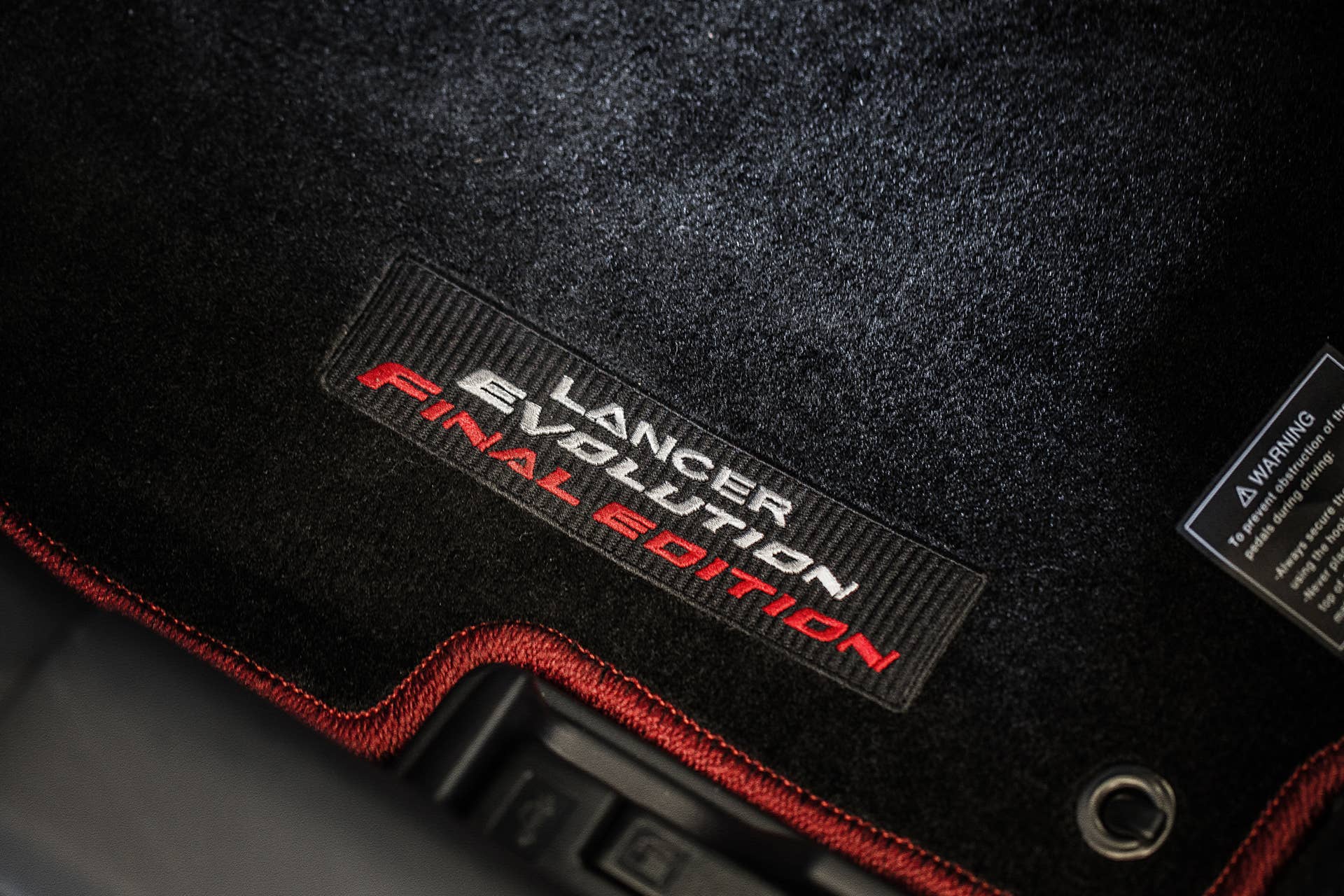 The 2015 Mitsubishi Lancer Evolution Final Edition, floor mat.