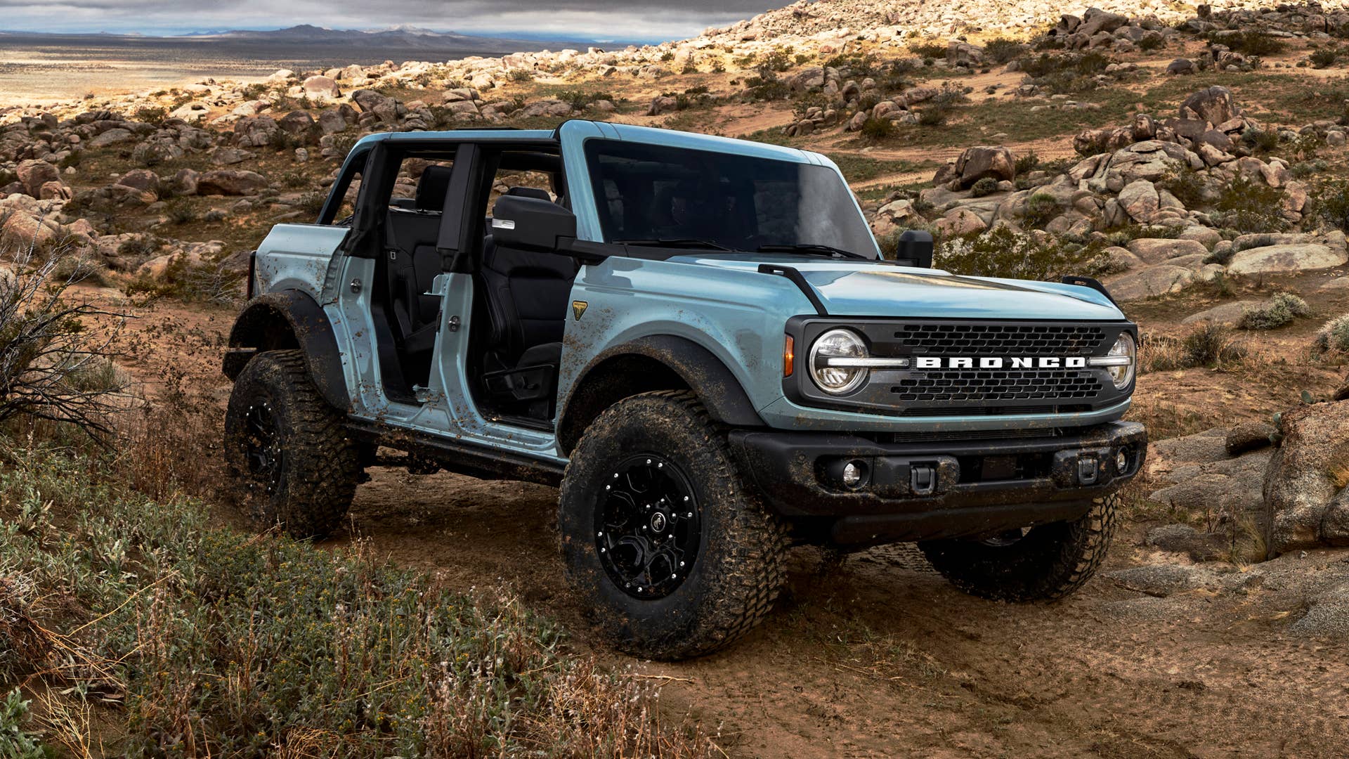 Pre-production 2021 Bronco four-door Badlands series with available Sasquatch™ off-road package in Cactus Gray with the doors, top and rear quarter windows removed.
