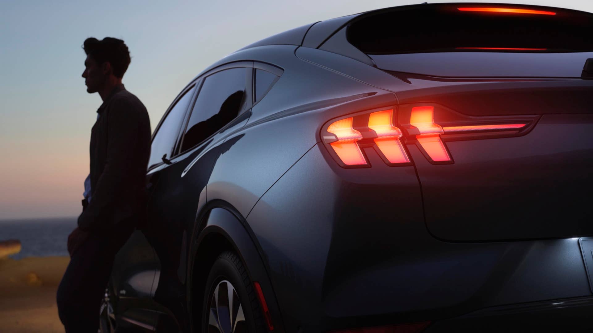 The Mustang Mach-E is instantly recognizable as a Mustang, with designers preserving the Mustang’s rear-haunch design and trademark tri-bar tail lamps, creating larger rear fenders that give the vehicle a wider feel and a more powerful stance
