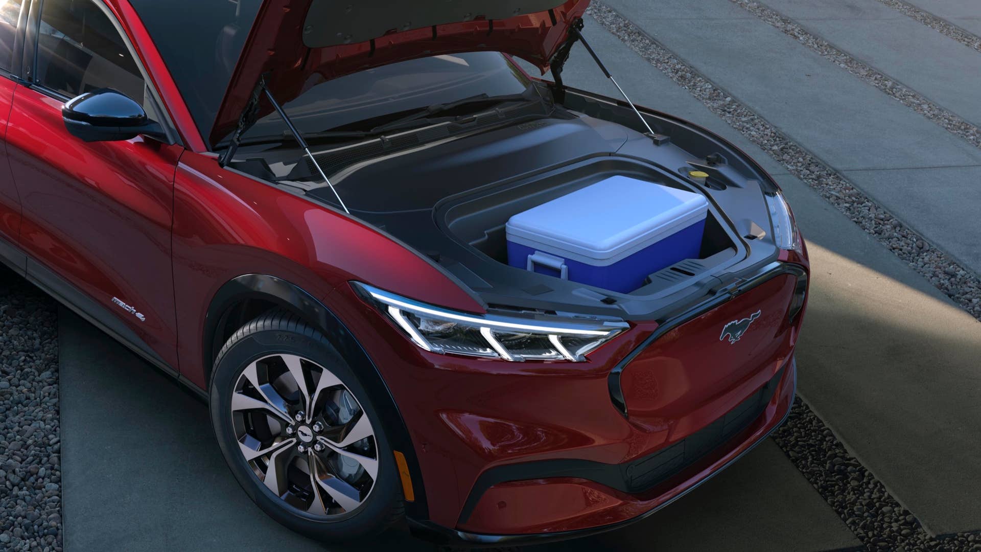 Along with its all-new propulsion system, the Mustang Mach-E holds another surprise under its hood: a drainable front trunk storage unit. Providing 4.8 cubic feet of storage space, the front trunk is large enough to comfortably store the equivalent of a carry-on luggage bag and several smaller bags.
