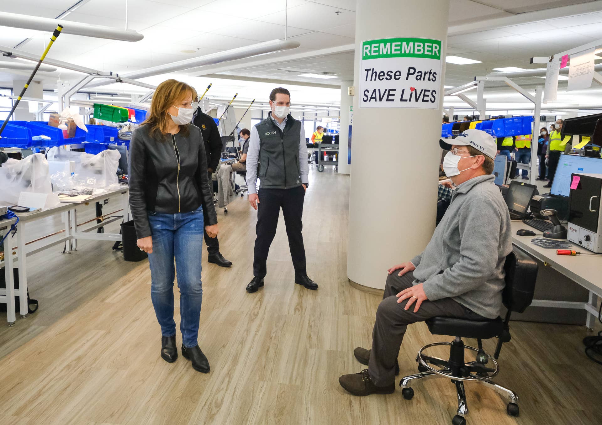 General Motors Chairman and CEO Mary Barra (l to r) and Ventec Life Systems CEO Chris Kiple talk with a worker while touring the GM manufacturing facility in Kokomo, Indiana, Tuesday, April 14, 2020. GM and Ventec Life Systems are partnering to produce Ventec critical care ventilators at the facility in response to the COVID-19 pandemic. (Photo by AJ Mast for General Motors)